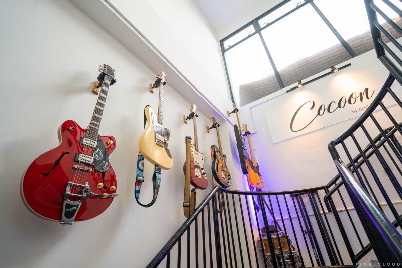 Glorious row of guitars lining the wall
